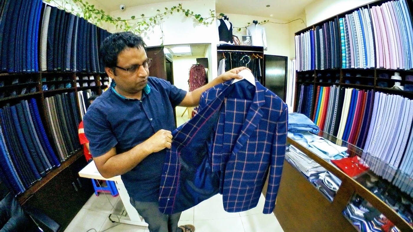 Tailor presenting a jacket